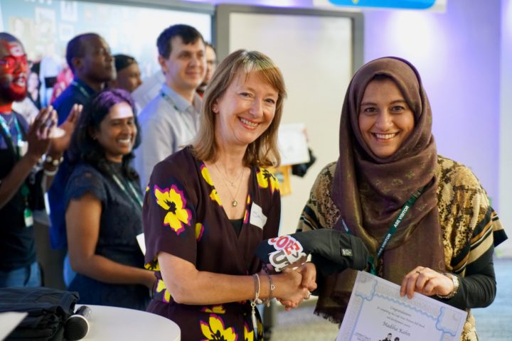 Madiha receiving her certificate at graduation