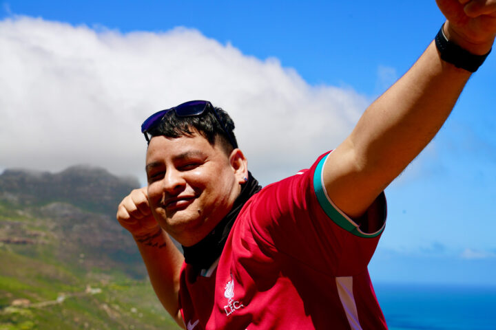 Shawen smiling outdoors with mountains behind