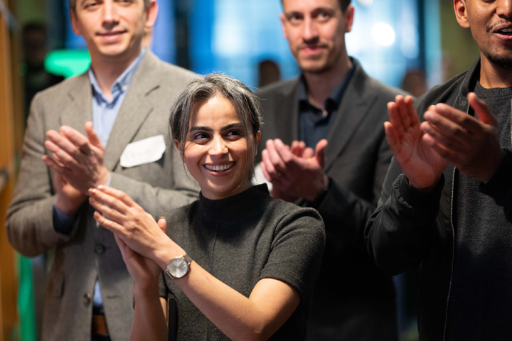 Volunteers applauding at a CodeYourFuture event