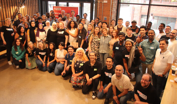 A large group photo of the CodeYourFuture community at the 2024 summit