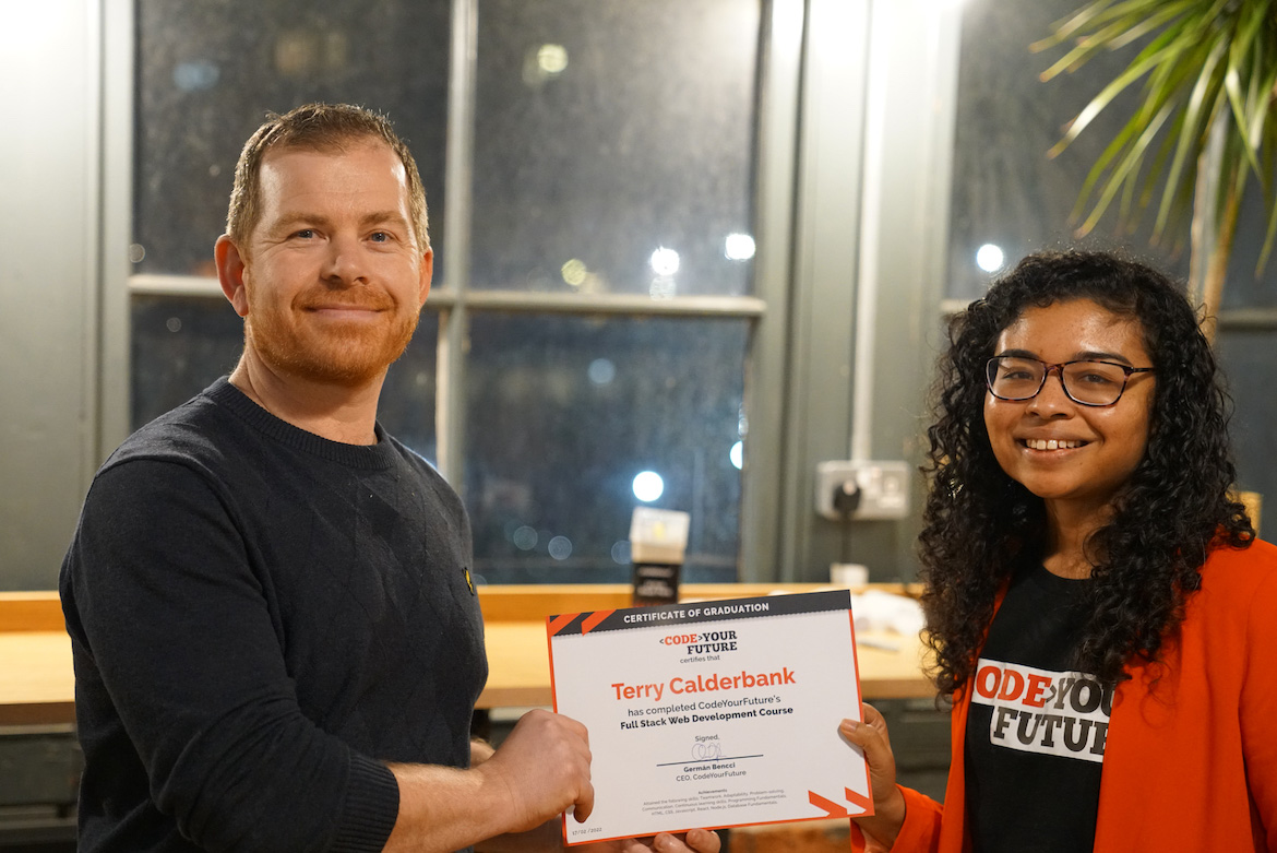 Terry receiving a certificate from CodeYourFuture.