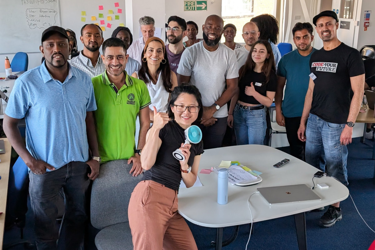 Group photo in an office setting.